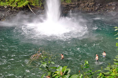 La Fortuna, Costa Rica - March 7, 2018: People swimming in the natural pool at La Fortuna Waterfalls in Costa Rica.のeditorial素材