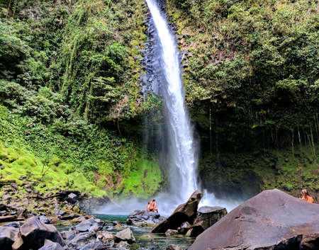 La Fortuna, Costa Rica - March 7, 2018: People swimming in the natural pool at La Fortuna Waterfalls in Costa Rica.のeditorial素材