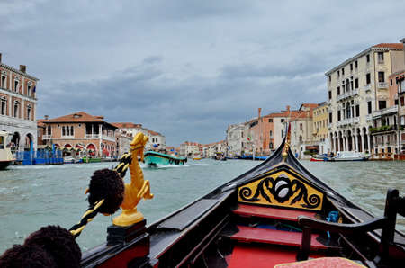 Traditional gondola on a canal in Venice, Italy.