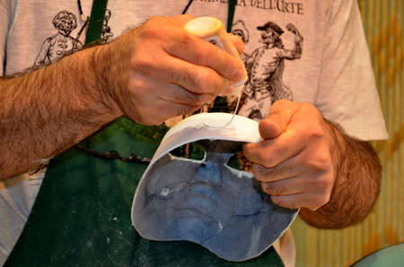 Venice, Italy, September 24, 2015:  An artisan works on a carnival mask in Venice, Italy.のeditorial素材