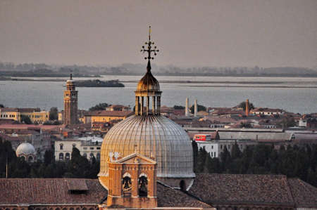 Aerial cityscape of Venice and domes at sunset, Italyの写真素材