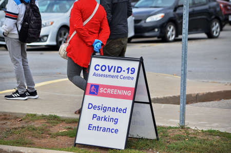 Scarborough, Ontario, Canada, September 29, 2020: People wait in line for a Covid-19 test at the...