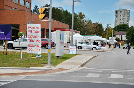 Scarborough, Ontario, Canada, September 29, 2020: People wait in line for a Covid-19 test at the...