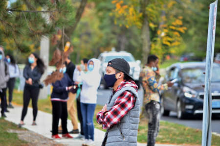 Scarborough, Ontario, Canada, September 29, 2020: People wait in line for a Covid-19 test at the Birchmount Covid-19 Assessment Centre at 3030 Birchmount Road in Scarborough, Ontario.のeditorial素材