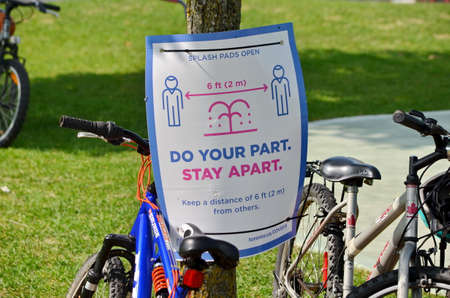 Toronto, Ontario, Canada, September 13, 2020: A Covid-19 sign in a City of Toronto park during the...