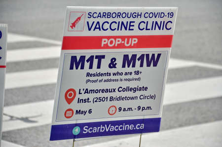 Scarborough, Ontario, Canada, May 6, 2021: People wait in line for a Covid-19 vaccine at the pop-up...
