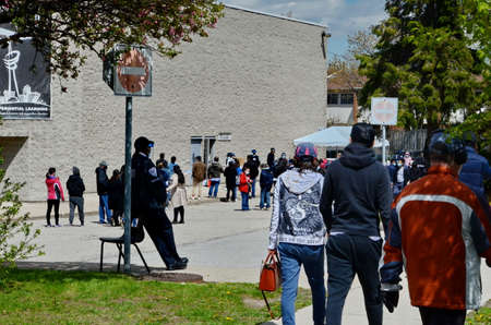 Scarborough, Ontario, Canada, May 6, 2021: People wait in line for a Covid-19 vaccine at the pop-up...