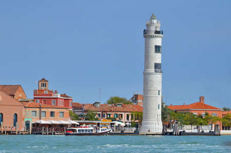 Murano Island in Venice with its beautiful lighthouse in Italy.の写真素材