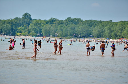 Prince Edward County, Ontario, Canada, July 13, 2022: People enjoy the beach at Sandbanks Provincial Park. Sandbanks is located on the north-east side of Lake Ontario.のeditorial素材