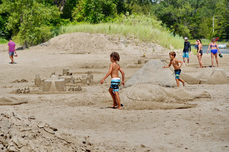 Prince Edward County, Ontario, Canada, July 13, 2022: People enjoy the beach at Sandbanks Provincial Park. Sandbanks is located on the north-east side of Lake Ontario.のeditorial素材