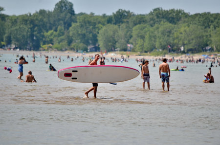 Prince Edward County, Ontario, Canada, July 13, 2022: People enjoy the beach at Sandbanks Provincial...