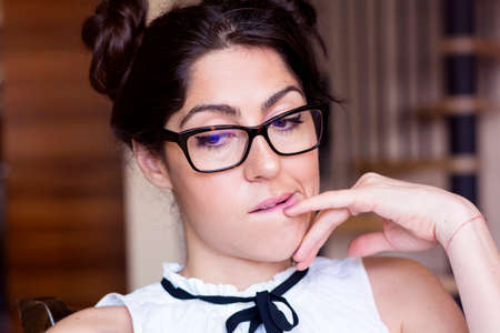 Portrait of beautiful young smiling woman with modern eyeglasses with black frameの写真素材