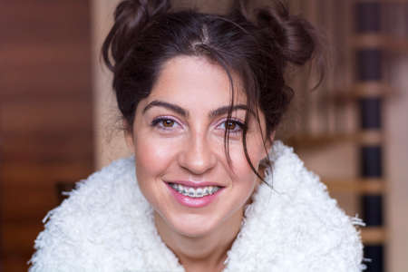 Portrait of a beautiful woman with braces on teeth. Orthodontic Treatment. Dental care Conceptの写真素材