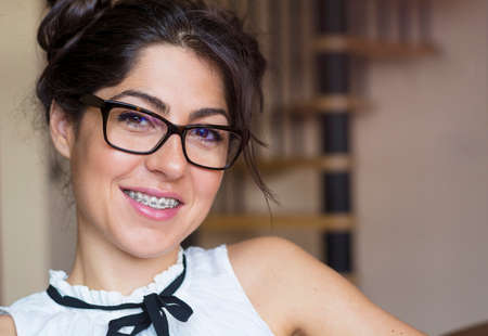 Portrait of a beautiful woman with braces on teeth. Orthodontic Treatment. Dental care Conceptの写真素材