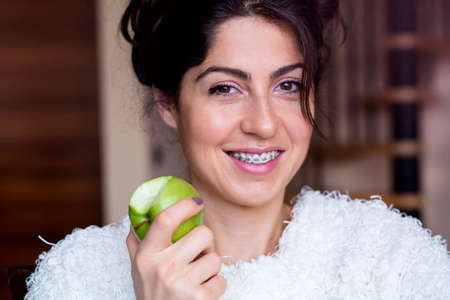 Portrait of a beautiful woman with braces on teeth. Orthodontic Treatment. Dental care Conceptの写真素材
