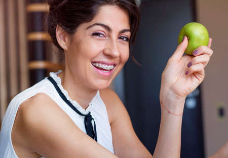 Portrait of a beautiful woman with braces on teeth. Orthodontic Treatment. Dental care Conceptの写真素材