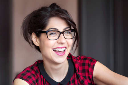 Portrait of a beautiful woman with braces on teeth. Orthodontic Treatment. Dental care Conceptの写真素材