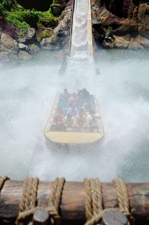 SALOU, SPAIN - MAY, 19,2017: Falling Down Water Ride with People at the Amusement Park Port Aventura near Barcelona.Tutuki Splash water ride is  in the Polynesia section of the parkのeditorial素材