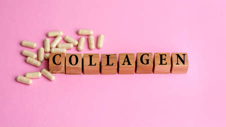 Collagen word written on wooden cubes and pillsの写真素材
