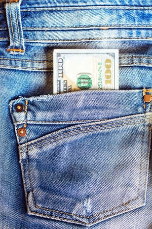 Money in the pocket of blue jeans. Money in jeans pocket.の写真素材