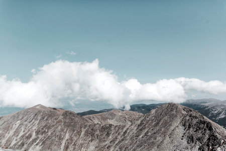 Mountain landscape with blue sky and white clouds. Natural background.の写真素材