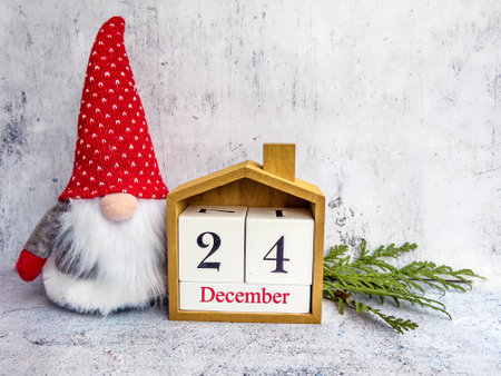 Wooden calendar with date december 24 and christmas gnomeの写真素材