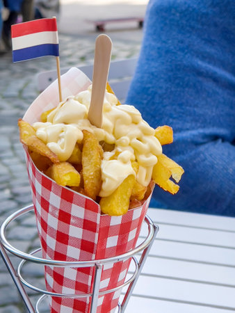 French fries with mayonnaise in a basketの写真素材