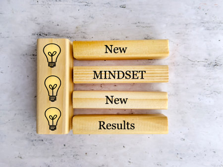 New mindset new results text on wooden blocks with lightbulb iconsの写真素材