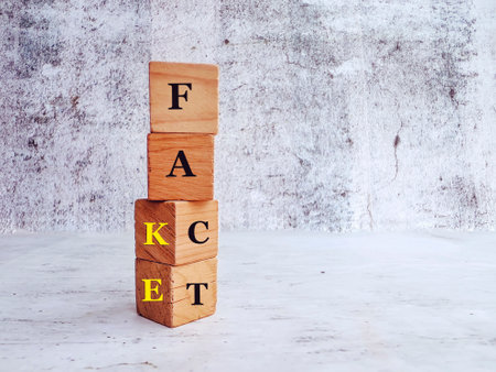 Conceptual image of the word FACT on wooden cubes.の写真素材