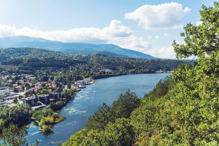 View from the top of the mountain to the city and the lakeの写真素材