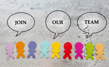 Teamwork concept. Colored paper people with speech bubbles on grey concrete background