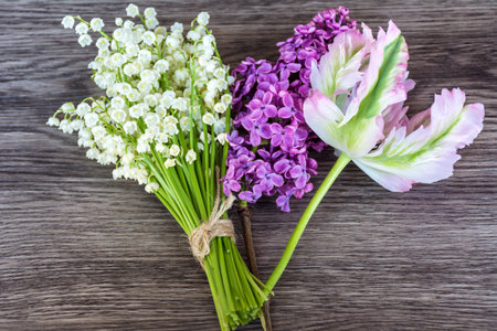 bouquet of lilies of the valley on a wooden backgroundの写真素材