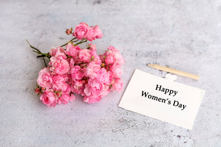 Pink roses and card with text Happy Mother's Day on concrete backgroundの写真素材