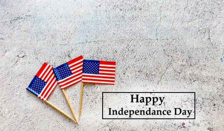 Happy Independence Day. USA flag with text Happy Independence Day on concrete backgroundの写真素材