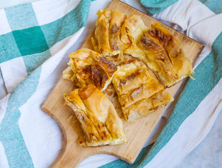 Homemade apple strudel on a wooden board, top viewの写真素材