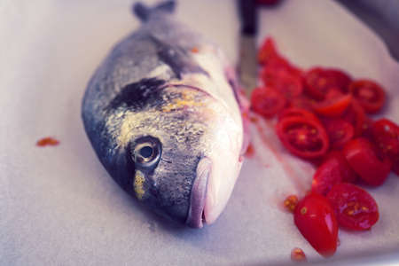 baked sea bream with tomatoes and parsley