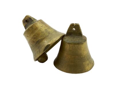 Two Small brass or bronze bells  leaning on one anotherの写真素材