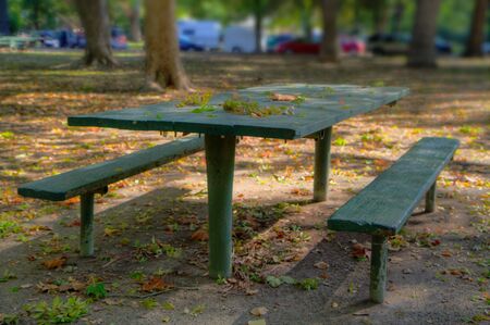 Green Park Picnic Bench done in high dynamic range HDR with soft focus backgroundの写真素材
