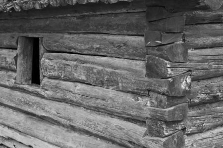Small log cabin with open window close up done in black and whiteの写真素材