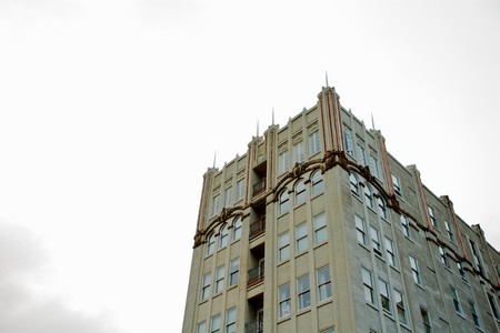 Deco building against a pale overcast skyの写真素材