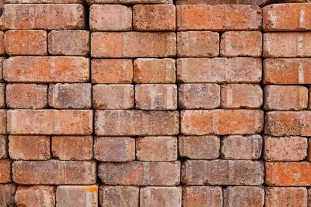 Wall or stack of red brick pavers at construction supply store