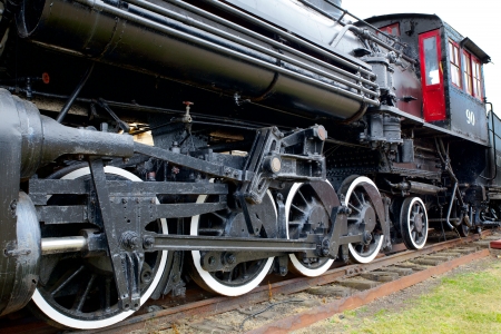 Old Black Steam Locomotive Train with closeup of wheels and boilerのeditorial素材