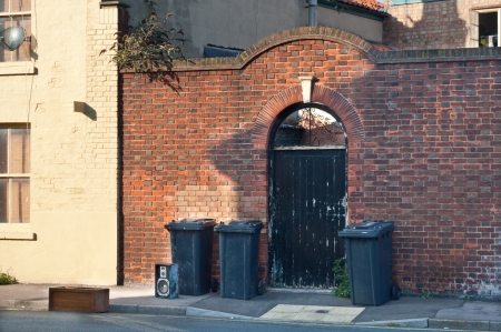 Bins and rubbish left out for disposalの写真素材