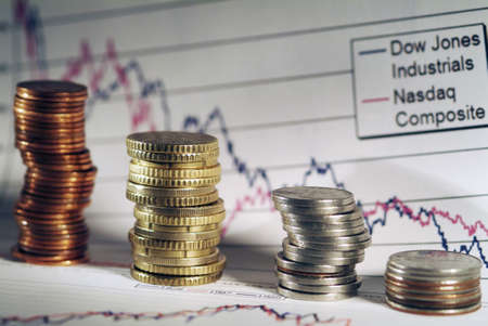 Coins with Business diagram on financial report . Shallow  focus.