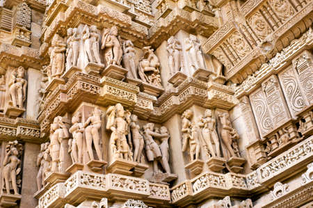 Stone carved erotic sculptures in Hindu temple in Khajuraho Madhya Pradesh Indiaの写真素材