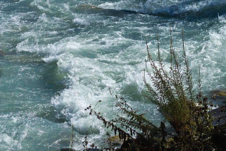 Rock rapids on the turbulent mountain river