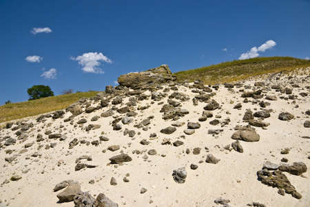 Ðccumulation of stones on a sandy outcropの写真素材