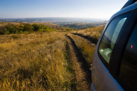 Dirt road behind the vehicle body