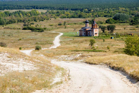 White road and the lone churchの写真素材