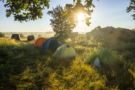 Quiet sunny morning in the tent camp of auto travelers through the steppe expansesの写真素材